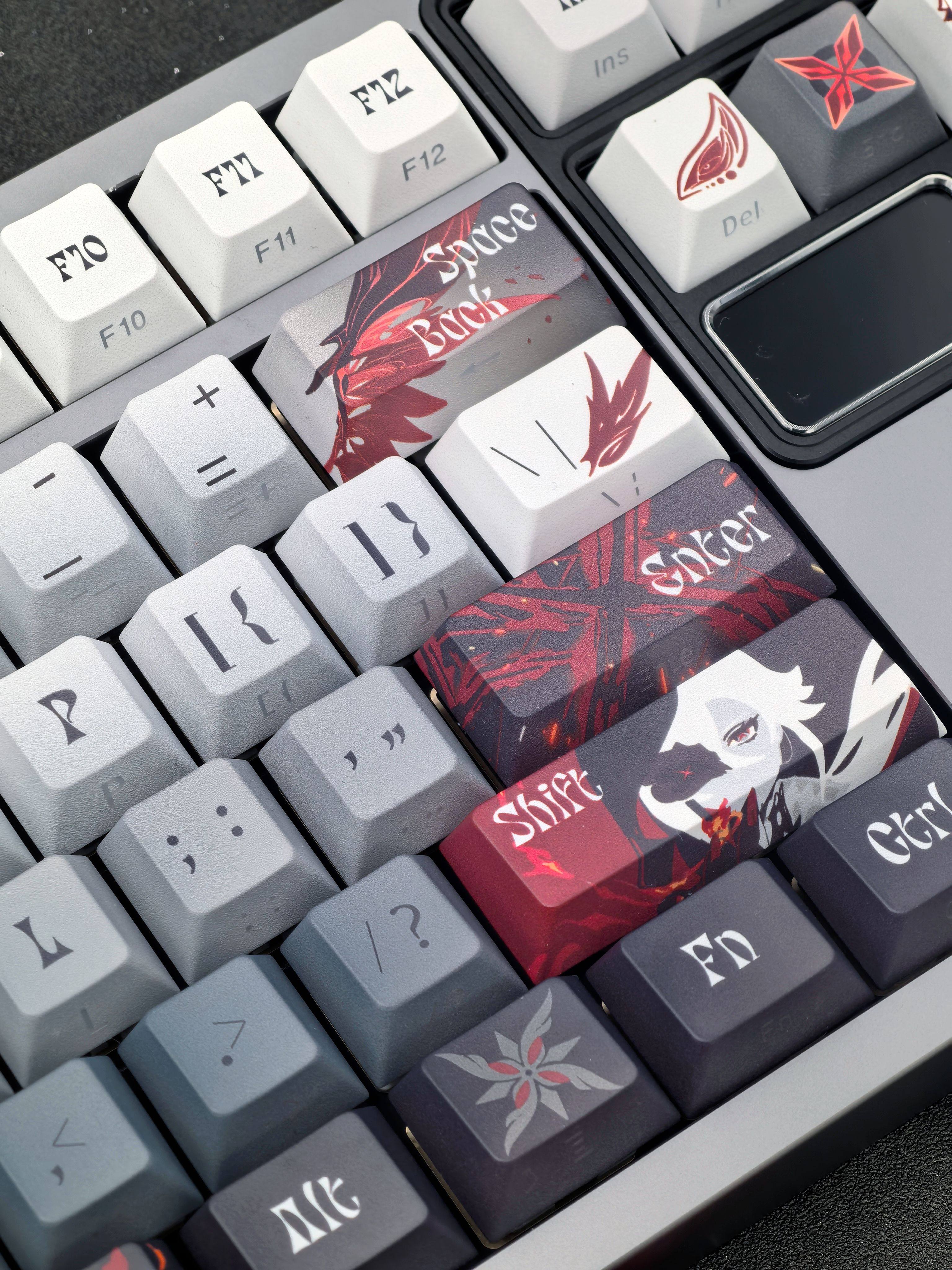 Close-up of Arlecchino Genshin Impact keycaps on a mechanical keyboard
