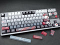 Close-up of Arlecchino Genshin Impact keycaps on a mechanical keyboard