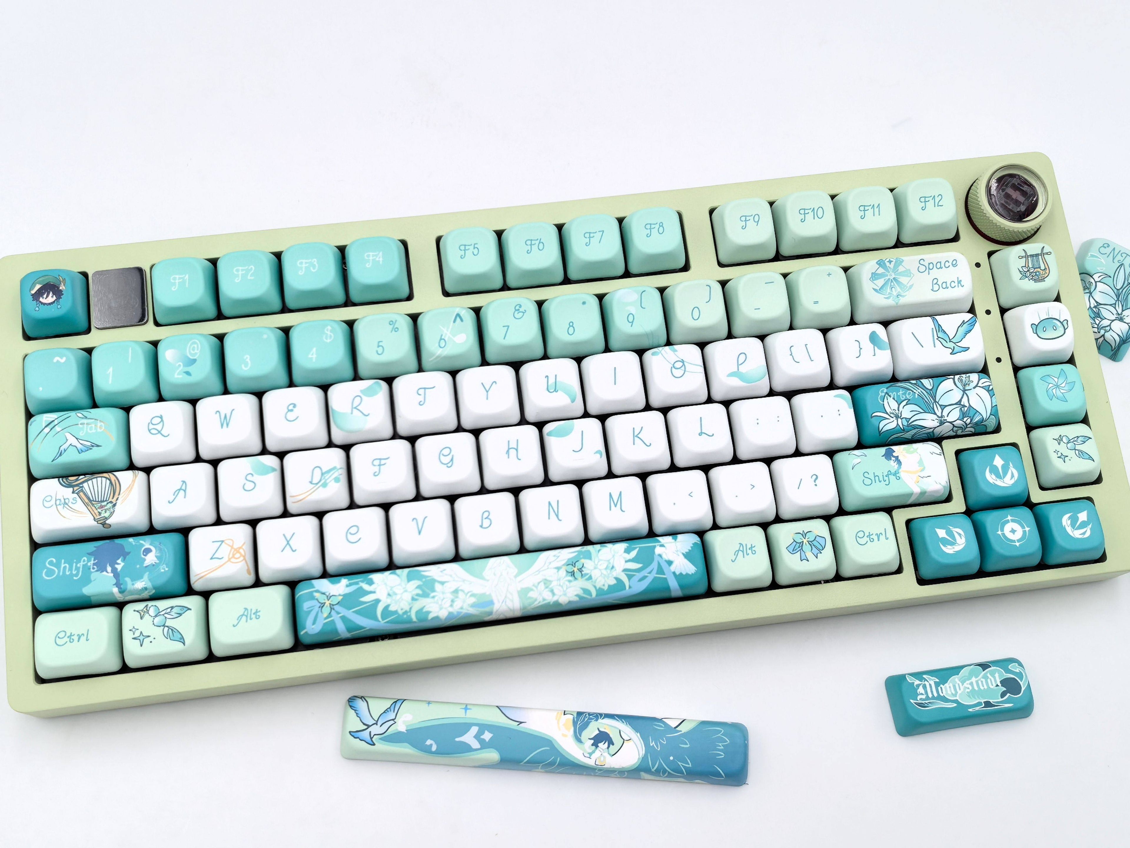Close-up of the left side of the Venti Genshin Impact keycap set on a mechanical keyboard, showing keys up to the I, K, M row