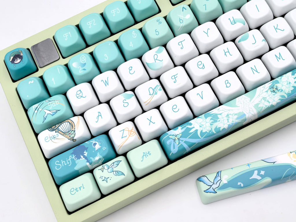 Close-up of the right side of the Venti Genshin Impact keycap set on a mechanical keyboard, showing the arrow keys